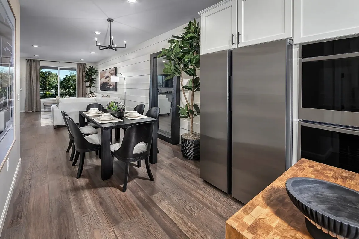Open living and dining area with balcony access