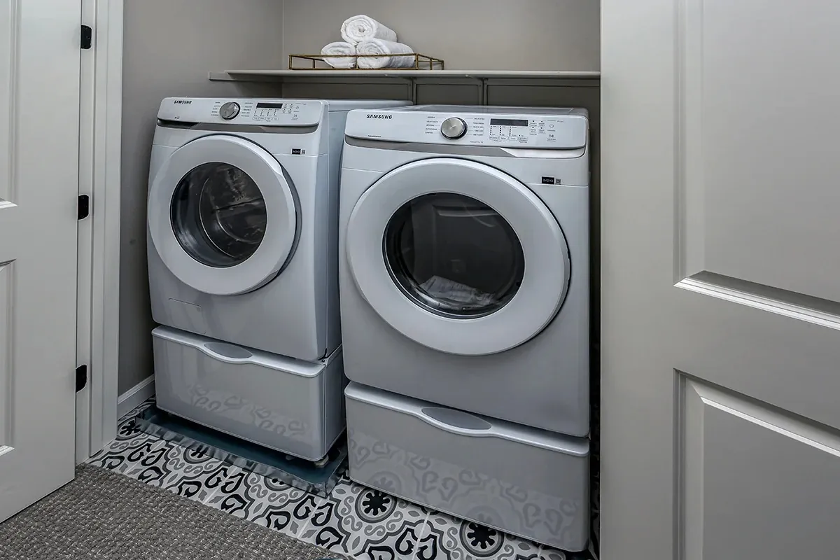 Laundry room with side-by-side washer and dryer