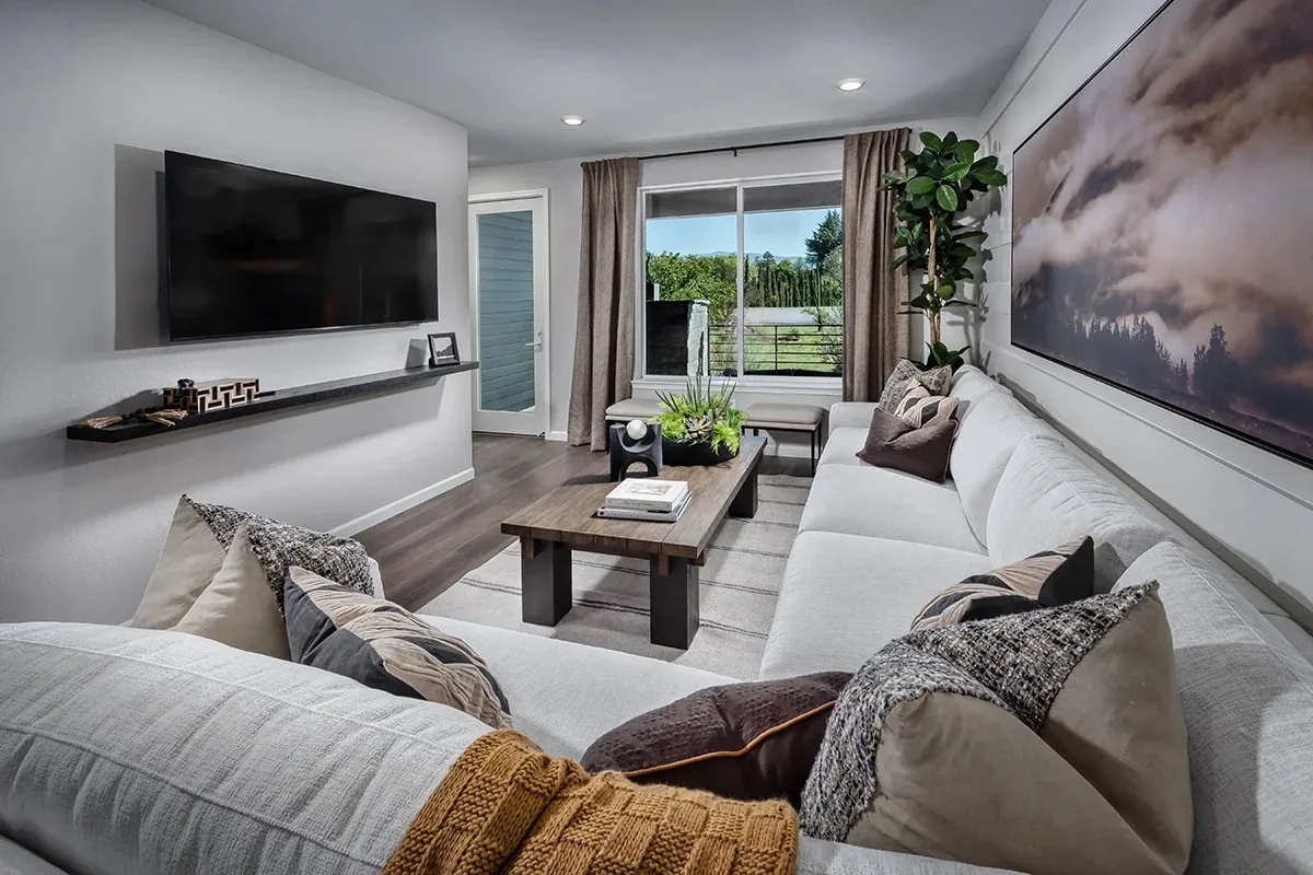 Living room with sectional and mounted television
