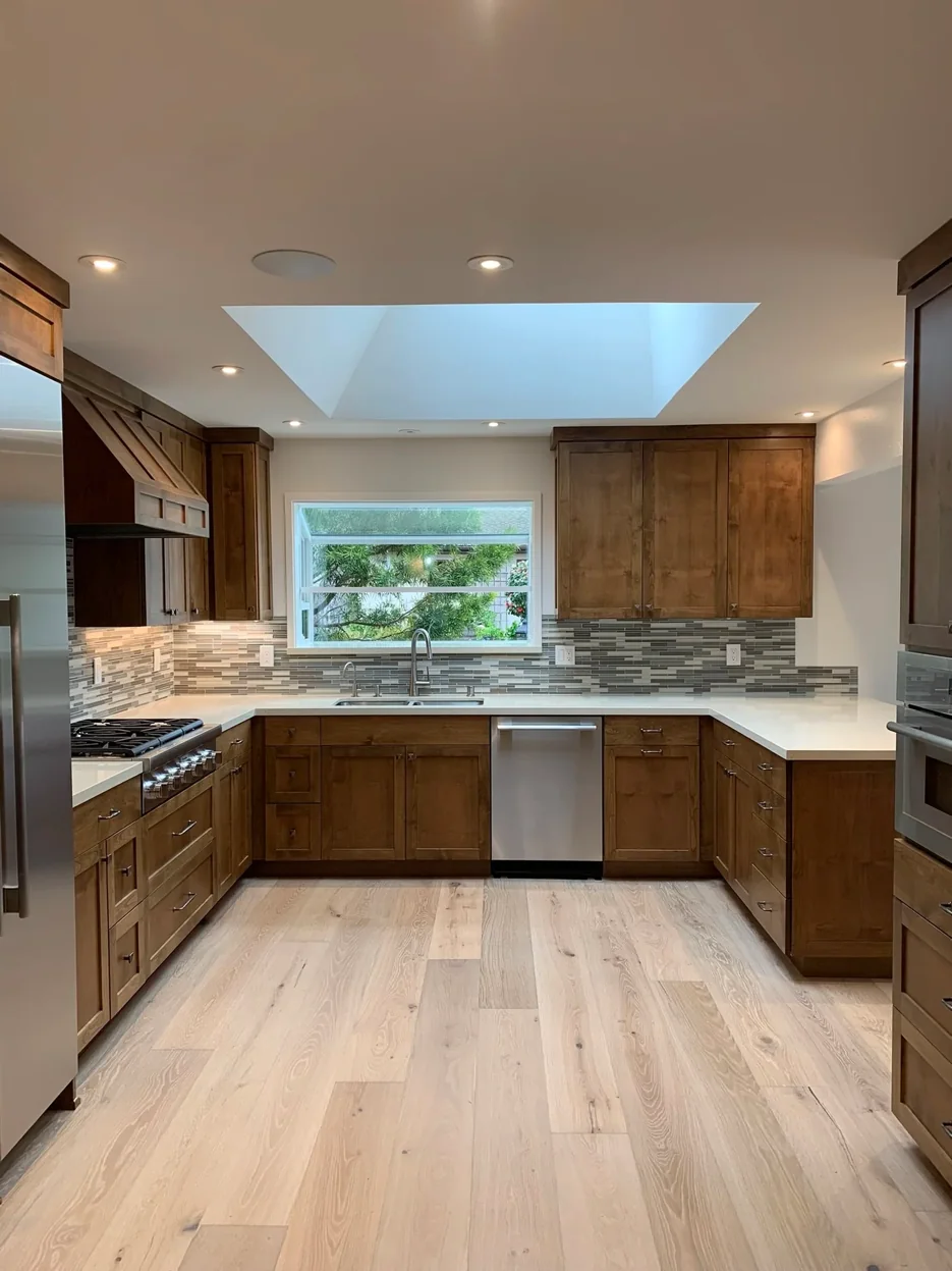 A kitchen updated in place with new counters, backsplash and flooring