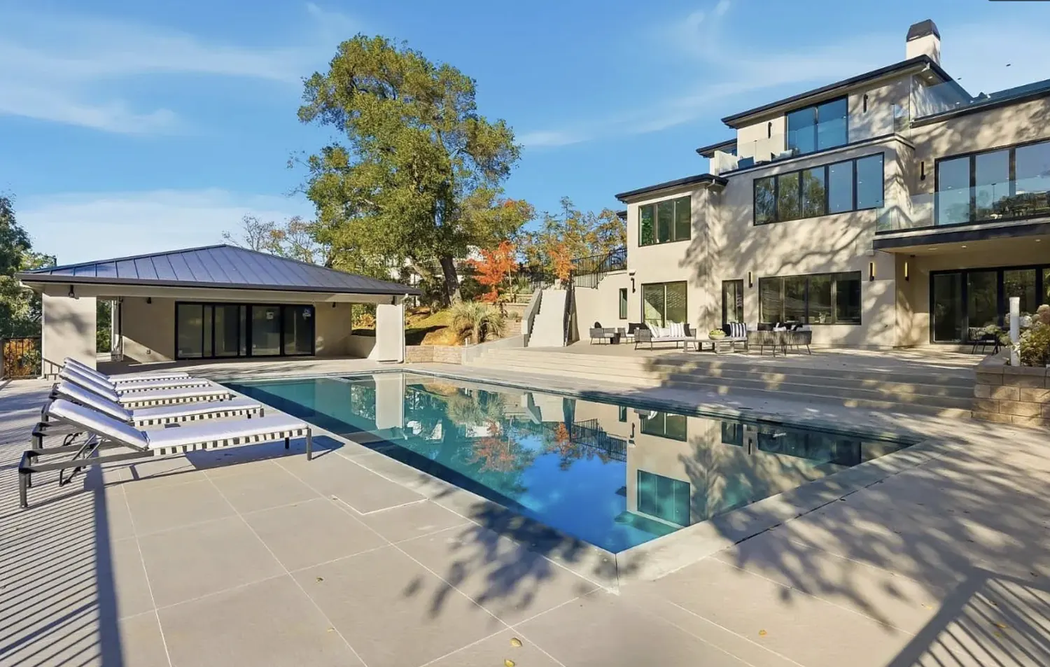 Pool and rear elevation at 20388 Hill Avenue, Saratoga, enclosed by trees